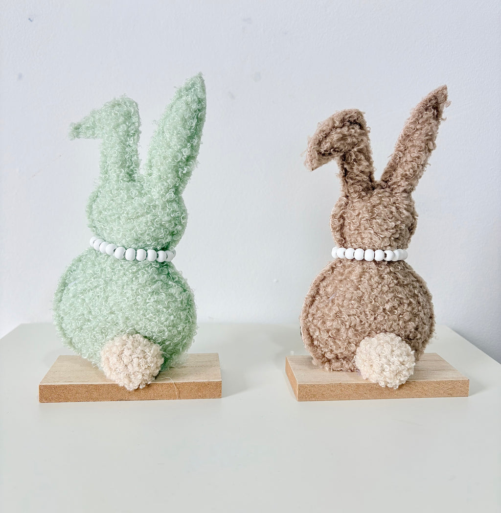 Green and Brown Rabbit on wooden base