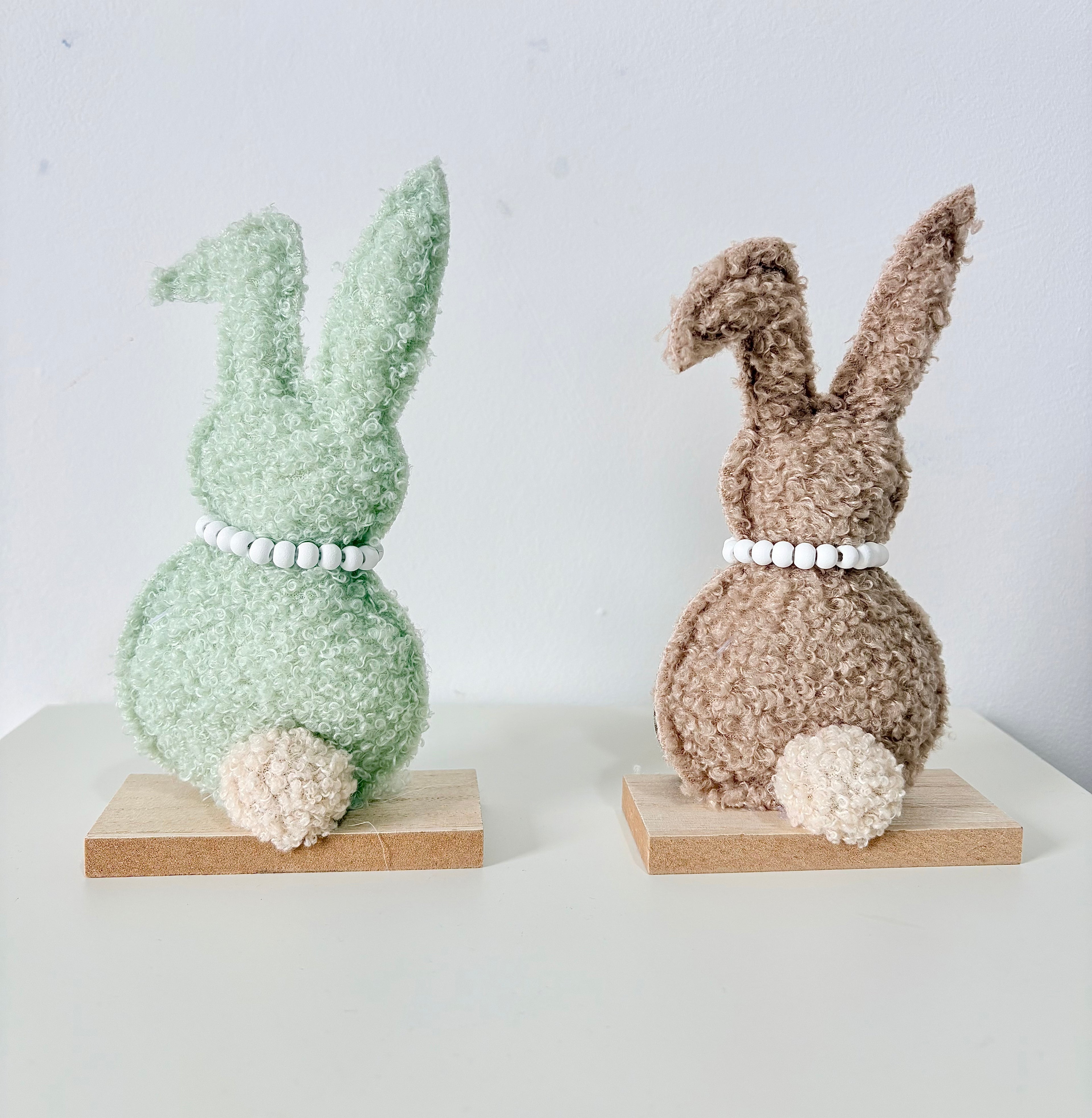 Green and Brown Rabbit on wooden base