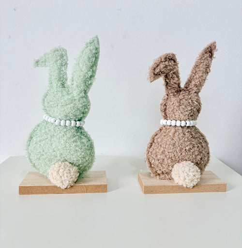 Green and Brown Rabbit on wooden base