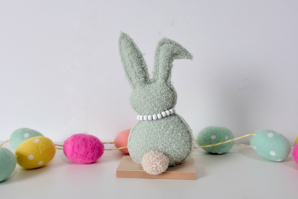 Green and Brown Rabbit on wooden base